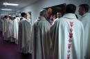Bishops wait to attend mass during a youth rally at the Verizon Center January 25, 2013 in Washington