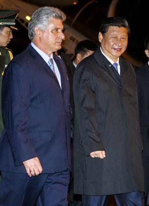 China President Xi Jinping (R) is welcomed by Cuban Vice President Miguel Diaz Canel (L) at Havana International Airport Jose Marti on July 21, 2014