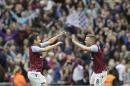 Aston Villa's Tom Cleverley and team mate Joe Cole celebrate after the end of the English FA Cup semifinal soccer match between Liverpool and Aston Villa at Wembley Stadium in London, Sunday, April 19, 2015. Aston Villa won the match 2-1 and will play Arsenal in the final.(AP Photo/Tim Ireland)