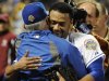 New York Mets starting pitcher Johan Santana, right, hugs manager Terry Collins after throwing a no-hitter against the St. Louis Cardinals in a baseball game on Friday, June 1, 2012, at Citi Field in New York. The Mets won 8-0. (AP Photo/Kathy Kmonicek)