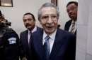 FILE - In this Jan. 24, 2013 file photo, Guatemala's former dictator Efrain Rios Montt (1982-1983) leaves the courtroom after his pre-trial hearing in Guatemala City. With his trial set to start Tuesday, March 19, 2013, prosecutors hope to painstakingly prove through a detailed recreation of the military chain of command that Rios Montt must have had knowledge of the massacres of Mayan Indians and others in the Guatemalan highlands. Because he held absolute power over the U.S.-backed military government, his failure to stop the slaughter is proof of his guilt, prosecutors and lawyers for victims say. (AP Photo/Moises Castillo, File)