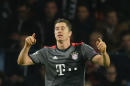 Bayern's Robert Lewandowski, celebrates after scoring during the Group D Champions League soccer match between PSV Eindhoven and Bayern Munich at the Philips stadium in Eindhoven, Netherlands, Tuesday, Nov. 1, 2016. (AP Photo/Peter Dejong)