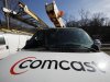FILE - This Feb. 15, 2011 file photo, shows a Comcast logo on a Comcast installation truck in Pittsburgh. Comcast said Wednesday, Nov. 2, 2011, its profit rose 5 percent in the third quarter as revenue at the nation's biggest cable television company climbed 51 percent. (AP Photo/Gene J. Puskar, File)