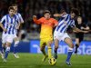 Barcelona's Lionel Messi tackles Real Sociedad's Carlos Martinez during their Spanish first division soccer match at Anoeta stadium in San Sebastian