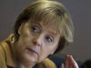 German Chancellor Angela Merkel reacts as she arrives at the weekly cabinet meeting  at the chancellery in Berlin, Wednesday, Dec. 7, 2011.  (AP Photo/Markus Schreiber)