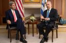Israeli Prime Minister Benjamin Netanyahu (R) speaks near US Secretary of State John Kerry during a meeting on November 6, 2013 in Jerusalem