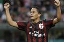 AC Milan's Carlos Bacca celebrates after scoring during the Serie A soccer match between AC Milan and Palermo at the San Siro stadium in Milan, Italy, Saturday, Sept. 19, 2015. (AP Photo/Antonio Calanni)