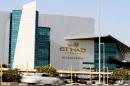 A car passes in front of headquaters of Etihad Airways in Abu Dhabi on March 13, 2014