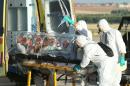 A file handout picture taken and released on August 7, 2014 by the Spanish Defense Ministry shows Roman Catholic priest Miguel Pajares, who contracted the deadly Ebola virus, being transported from Madrid's Torrejon air base to Carlos III hospital