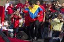 Venezuela's President Nicolas Maduro dances on stage during a May Day rally in Caracas