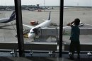 A boy looks at planes at the transit area of Moscow's Sheremetyevo airport