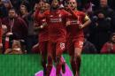 Liverpool's striker Daniel Sturridge (C) celebrates scoring his team's first goal during the UEFA Europa League round of 16, first leg football match between Liverpool and Manchester United in Liverpool, England on March 10, 2016