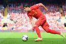 Liverpool's Uruguayan striker Luis Suarez runs with the ball during the English Premier League football match between Liverpool and Chelsea at Anfield Stadium in Liverpool on April 27, 2014