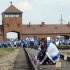 Young Jews place plaques on railway tracks at the Auschwitz Nazi death camp at a ceremony in April