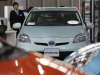 A Toyota Motor Corp Prius vehicle and other vehicles are displayed at the company's showroom in Tokyo