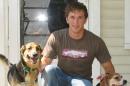 In this undated photo provided by Mark Eisenhauer, Joshua Eisenhauer poses for a photograph with his dogs. When Eisenhauer emptied 24 rounds from his 9mm handgun at police and firefighters responding to a fire in his Fayetteville, N.C., apartment, the former Army sergeant believed he was shooting at the Taliban bomber whose truckload of explosives blew the limbs off his friend, his defenders say. The only place where he belongs is one he can get treatment for his PTSD, said Eisenhauer's father, Mark. (Mark Eisenhauer via AP)