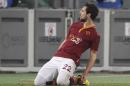 AS Roma forward Mattia Destro celebrates after scoring during a Serie A soccer match between AS Roma and Torino, at Rome's Olympic Stadium, Tuesday, March 25, 2014. (AP Photo/Andrew Medichini)