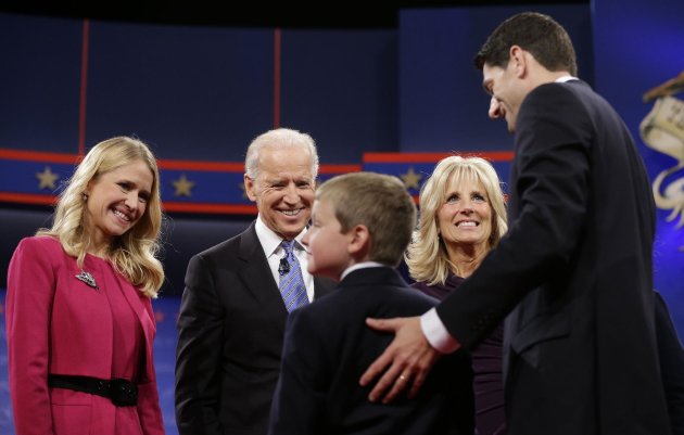 Vice President Joe Biden, center, and his wife Jill Biden, meet with Republican vice presidential candidate, Rep. Paul Ryan, R-Wis., right, his wife Janna Ryan, left, and son Charlie Ryan, center, on stage after the vice presidential debate, at Centre College in Danville, Ky., Thursday, Oct. 11, 2012. (AP Photo/Pablo Martinez Monsivais)
