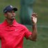 Tiger Woods of the U.S. catches his ball before making a par on the 11th hole during the final round of the Memorial Tournament at Muirfield Village Golf Club in Dublin