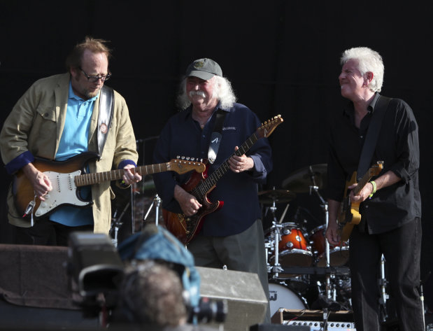 FILE - In this June 27, 2010 file photo, Stephen Stills, from left, David Crosby and Graham Nash, from the band Crosby, Stills and Nash perform in Hyde Park, London. The band surprised the audience when they walked onstage uncharacteristically dressed in formal dark gray Brooks Brothers suits for a benefit concert with Wynton Marsalis' Jazz at Lincoln Center Orchestra, Saturday, May 4, 2013, in New York. (AP Photo/Andy Paradise, file) EDITORIAL USE ONLY.