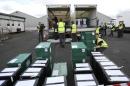 City council workers assemble ballot boxes for distribution ahead of tomorrow's general election, in Glasgow Scotland