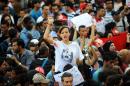 A Tunisian protester, wearing a shirt depicting late opposition figure Chokri Belaid, shouts slogans during a demonstration in Tunis on October 23, 2013