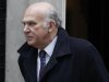 Britain's Business Secretary Vince Cable walks out of 10 Downing Street in central London