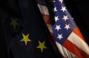 An EU flag and an U.S. flag are pictured in Berlin