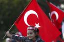A girl waves a Turkish flag during a Republic Day ceremony in Istanbul, Turkey