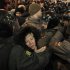 Police push people out from a square to prevent a protest against alleged vote rigging in Russia's parliamentary elections in Triumphal Square in Moscow, Russia, Wednesday, Dec. 7, 2011. Protesters energized by the declining electoral fortunes of Russia's ruling party try for a third straight night of demonstrations in Moscow, facing off against a heavy police contingent.(AP Photo/Ivan Sekretarev)