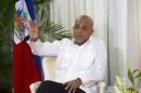 FILE - In this Dec. 21, 2015 file photo, Haiti's President Michel Martelly speaks during an interview at the National Palace in Port-au-Prince, Haiti. Martelly, who is constitutionally due to leave office on Feb. 7, said on Friday, Jan. 1, 2016 that the postponed presidential runoff vote will be held on Jan. 17. (AP Photo/Dieu Nalio Chery, File)