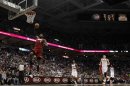 Heat' James goes in for a dunk during the first half of Game 4 of his NBA first round playoff series against the Bucks in Milwaukee