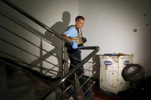 A U.N. official walks at a staircase covered in blood&nbsp;&hellip;