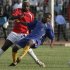 Swaziland's Tsabedze is tackled by Kenya's Oyombe during African Cup of Nations qualifier in Nairobi