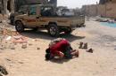 Fighters from Libyan forces allied with the U.N.-backed government pray in neighbourhood Number Three in Sirte