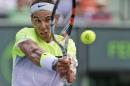RETRANSMISSION TO CORRECT SPELLING OF SURNAME - Rafael Nadal of Spain, returns a shot from Nicolas Almagro of Spain, at the Miami Open tennis tournament, Friday, March 27, 2015 in Key Biscayne, Fla. (AP Photo/Wilfredo Lee)