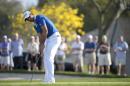 Jason Day, of Australia, watches his putt on the 13th green during the second round of the Arnold Palmer Invitational golf tournament in Orlando, Fla., Friday, March 18, 2016. (AP Photo/Phelan M. Ebenhack)