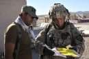 Staff Sgt. Robert Bales (R), pictured August 21, 2011, at the National Training Center in Fort Irwin, California