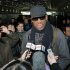 Former NBA star Dennis Rodman speaks to the media at the Pyongyang Airport in Pyongyang, before he leaves North Korea Friday, March 1, 2013.  Ending his unexpected round of basketball diplomacy in North Korea on Friday, Rodman called leader Kim Jong Un an "awesome guy" and said his father and grandfather were "great leaders."  (AP Photo/Kyodo News) JAPAN OUT, MANDATORY CREDIT, NO LICENSING IN CHINA, HONG KONG, JAPAN, SOUTH KOREA AND FRANCE