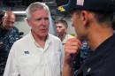 Navy Secretary Ray Mabus, left, speaks to the USS Independence's captain, Cmdr. Joseph Gagliano, on board the ship in waters off Honolulu on Thursday, July 24, 2014. Mabus says operating costs for the service's newest ships, littoral combat ships like the Independence, will decline and 