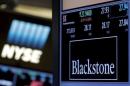 FILE PHOTO - The ticker and trading information for Blackstone Group is displayed at the post where it is traded on the floor of the New York Stock Exchange