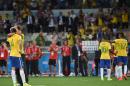 Brazil's David Luiz (L) is embraced by teammate and captain Thiago Silva after being defeated in their semi-final football match against Germany in Belo Horizonte on July 8, 2014, during the 2014 FIFA World Cup