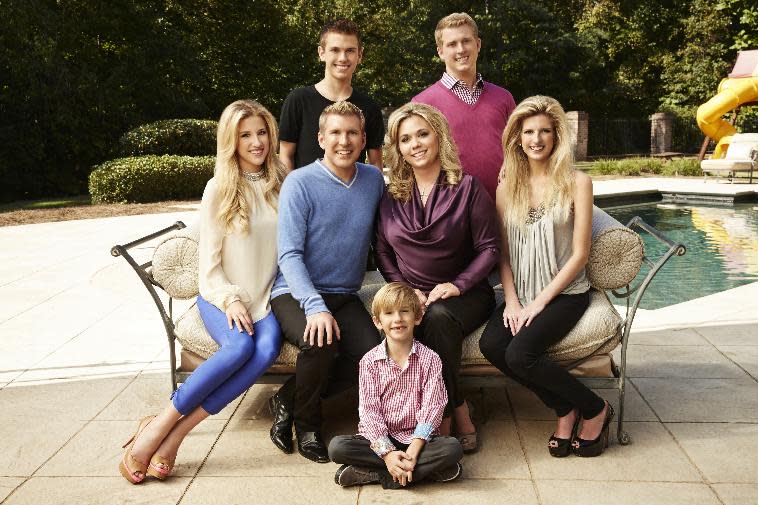 This Oct. 2, 2013 photo released by USA Network shows the cast of "Chrisley Knows Best," back row from left,  Chase Chrisley and Kyle...