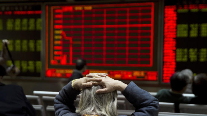World stocks slide as China trading halted after plunge