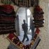 An Afghan policeman is reflected in a mirror at a hotel on the outskirts of Kabul