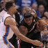 Miami Heat small forward LeBron James  is guarded by Oklahoma City Thunder shooting guard Thabo Sefolosha (2) of Switzerland during the first half at Game 2 of the NBA finals basketball series, Thursday, June 14, 2012, in Oklahoma City. (AP Photo/Jeff Roberson)