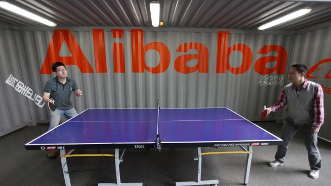 File photo of employees playing table tennis inside the headquarters office of Alibaba (China) Technology Co. Ltd on the outskirts of Hangzhou