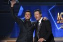 Luke Bryan celebrates with Blake Shelton after winning the award for entertainer of the year at the 48th ACM Awards in Las Vegas