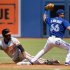 Baltimore Orioles Chris Dickerson is safe at second after Toronto Blue Jays Munenori Kawasaki applied the tag during the first inning of their MLB American League baseball game in Toronto