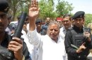 Samajwadi Party Chief Mulayam Singh Yadav waves to his supporters at Mainpuri